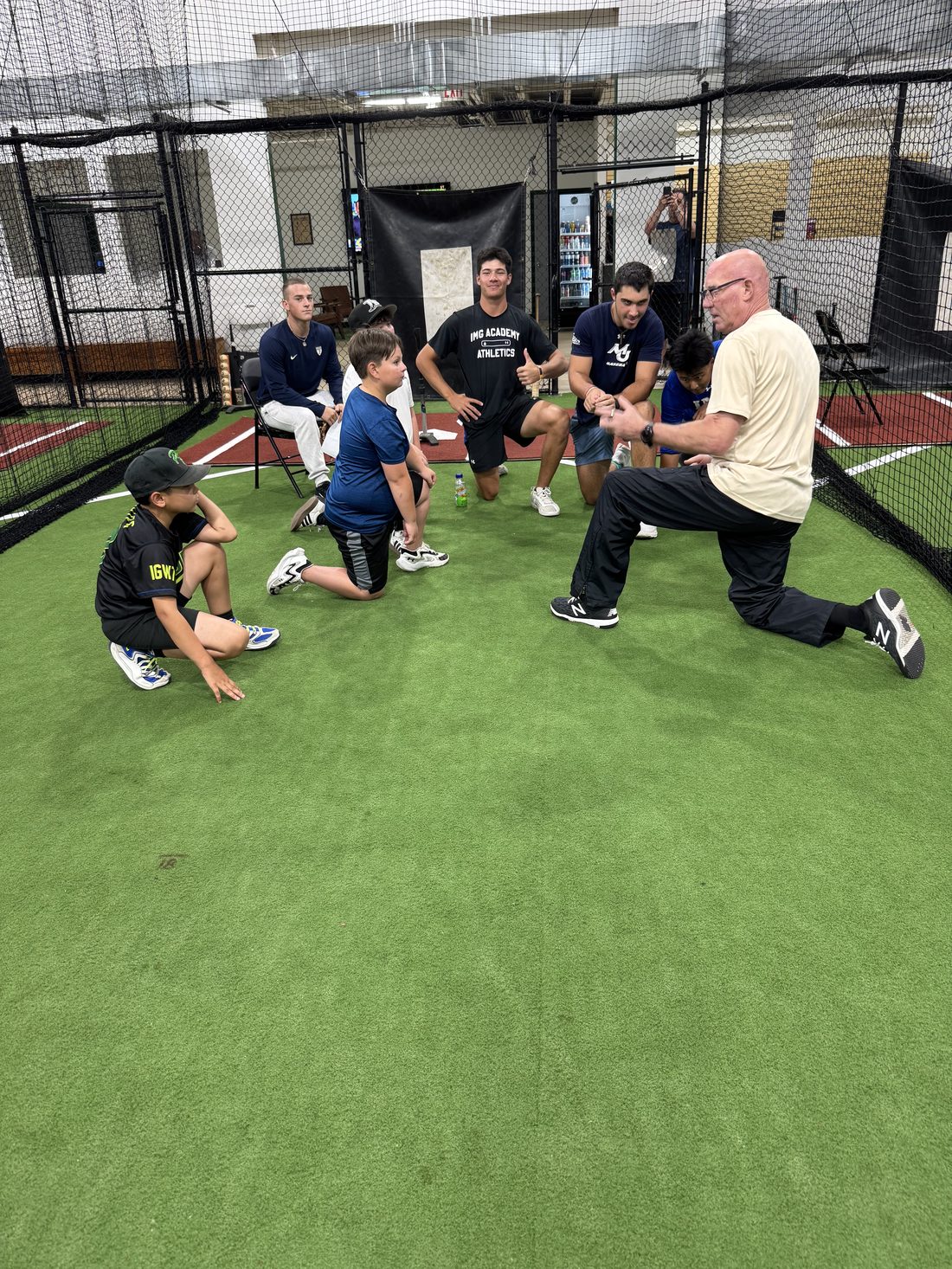 FLX coaches working with campers on the turf