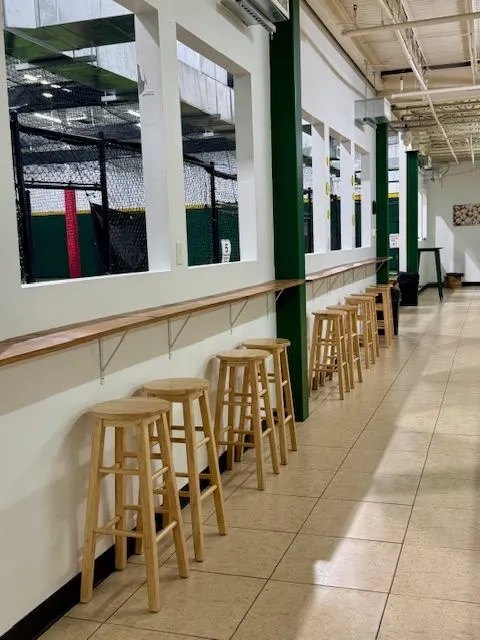 Parent viewing corridor with seating overlooking the FLX cages